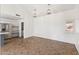 Open-concept living area featuring tile flooring and a view to the kitchen with natural light at 4007 W Thunderbird Rd, Phoenix, AZ 85053