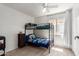 Bright bedroom with wood floors and bunk beds at 4232 N 112Th Ln, Phoenix, AZ 85037