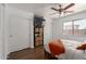 Bedroom featuring wood floors, closet, and bright window at 4232 N 112Th Ln, Phoenix, AZ 85037