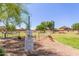 Community dog park features lush greenery, benches, and secure fencing at 4232 N 112Th Ln, Phoenix, AZ 85037
