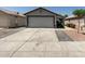 Charming single-story home featuring a two-car garage and well-maintained landscaping at 4232 N 112Th Ln, Phoenix, AZ 85037