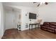 Open-concept living room features stylish decor and modern lighting fixtures at 4232 N 112Th Ln, Phoenix, AZ 85037