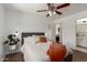 Bedroom featuring wood floors and view to ensuite at 4232 N 112Th Ln, Phoenix, AZ 85037