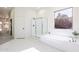 Bright bathroom with a soaking tub, glass-enclosed shower, and hexagonal tile floor at 4356 E Carriage Way, Gilbert, AZ 85297