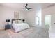 Bedroom featuring modern furniture and neutral decor with an ensuite bathroom at 4356 E Carriage Way, Gilbert, AZ 85297