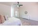Bright bedroom with a ceiling fan and a modern dresser, offering ample storage space at 4356 E Carriage Way, Gilbert, AZ 85297