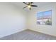 Bedroom with carpeted floors and a window showing outside views at 4356 E Carriage Way, Gilbert, AZ 85297