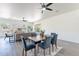 Bright dining area with modern finishes, neutral walls, and a view into the living room at 4356 E Carriage Way, Gilbert, AZ 85297