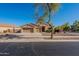 Charming home featuring a well-manicured front yard, desert landscaping, and a spacious three-car garage at 4356 E Carriage Way, Gilbert, AZ 85297