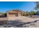 Attractive single-story home featuring a large driveway leading to a three-car garage and desert landscaping at 4356 E Carriage Way, Gilbert, AZ 85297
