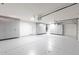 Spacious garage with epoxy flooring and built-in storage cabinets at 4356 E Carriage Way, Gilbert, AZ 85297