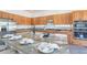 Modern kitchen featuring granite countertops, stainless steel appliances and wooden cabinetry at 4356 E Carriage Way, Gilbert, AZ 85297