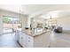 Open concept kitchen with island, breakfast bar, and stainless steel appliances at 4356 E Carriage Way, Gilbert, AZ 85297