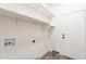 Functional laundry room with built-in shelving and door to other rooms at 4356 E Carriage Way, Gilbert, AZ 85297
