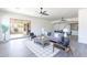 Spacious living room with ceiling fans, backyard access, and modern decor at 4356 E Carriage Way, Gilbert, AZ 85297