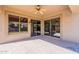 Inviting covered patio featuring tile flooring, ceiling fan, and seamless access to the indoors with sliding glass doors at 4356 E Carriage Way, Gilbert, AZ 85297