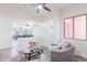 Comfortable sitting area with neutral tones, contemporary furnishings, and an open view of the dining area at 4356 E Carriage Way, Gilbert, AZ 85297