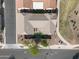 A bird's eye view of a landscaped backyard with patio, turf, trees and shrubs at 4646 E Maplewood St, Gilbert, AZ 85297