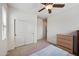 Neutral bedroom featuring a ceiling fan and closet with sliding doors at 4646 E Maplewood St, Gilbert, AZ 85297