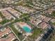 A picturesque community pool area surrounded by lush landscaping and single Gathering homes at 4646 E Maplewood St, Gilbert, AZ 85297