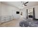 Bright main bedroom features a ceiling fan, en suite bath and carpet at 4646 E Maplewood St, Gilbert, AZ 85297