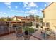 Elevated patio offering views of the outdoor kitchen, screened porch, and lush landscaping in backyard at 4715 E Carmen St, Phoenix, AZ 85044