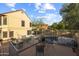 Backyard patio area with dining set, views of the home, and a glimpse of the inviting pool area at 4715 E Carmen St, Phoenix, AZ 85044