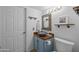 Charming bathroom features a wood countertop, decorative mirror, and stylish fixtures and is adjacent to the toilet at 4715 E Carmen St, Phoenix, AZ 85044