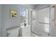 Updated bathroom with shower, toilet, vanity, and a window, offering functionality and comfort at 4715 E Carmen St, Phoenix, AZ 85044