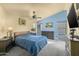 Relaxing bedroom features soft lighting, neutral colors, and a ceiling fan for a comfortable, airy atmosphere at 4715 E Carmen St, Phoenix, AZ 85044