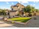 Charming two-story home featuring a well-manicured lawn and inviting curb appeal at 4715 E Carmen St, Phoenix, AZ 85044