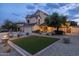 Charming two-story home with a well-manicured lawn, complemented by mature trees at 4715 E Carmen St, Phoenix, AZ 85044