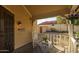 Charming front porch featuring rocking chairs and a cozy outdoor seating area at 4715 E Carmen St, Phoenix, AZ 85044