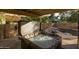 Outdoor hot tub with a retractable cover, nestled in a private area with a view of the backyard at 4715 E Carmen St, Phoenix, AZ 85044
