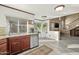Open kitchen boasts stainless steel appliances and abundant natural light from large picture window overlooking yard at 4715 E Carmen St, Phoenix, AZ 85044