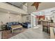 Open-concept living room flows seamlessly into a modern kitchen, creating a perfect space for entertaining guests or relaxing at 4715 E Carmen St, Phoenix, AZ 85044
