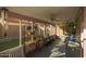 Enclosed patio with tile flooring, ceiling fan, exercise equipment, and plenty of natural light at 4715 E Carmen St, Phoenix, AZ 85044