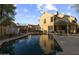 Large swimming pool with patio, complemented by the home's exterior and balcony, ideal for outdoor living at 4715 E Carmen St, Phoenix, AZ 85044