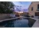 An inviting pool area with lush greenery, offering a private retreat for relaxation and outdoor enjoyment at 4715 E Carmen St, Phoenix, AZ 85044