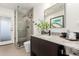 Bathroom featuring a sleek vanity, marble countertop, and a tiled walk-in shower at 4835 E Onyx Ave, Paradise Valley, AZ 85253
