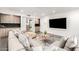 Comfortable living area featuring a large TV and built-in cabinets at 4835 E Onyx Ave, Paradise Valley, AZ 85253