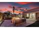 Inviting outdoor patio with a modern firepit, plush seating, and seamless indoor-outdoor living at 4835 E Onyx Ave, Paradise Valley, AZ 85253