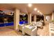 Covered outdoor patio with furniture and an inviting pool, perfect for entertaining at 4835 E Onyx Ave, Paradise Valley, AZ 85253