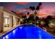 This backyard features a modern pool with uplighting, perfect for evening relaxation at 4835 E Onyx Ave, Paradise Valley, AZ 85253