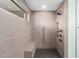 Walk-in shower with a bench, tile surround, and modern shower fixtures at 4835 E Onyx Ave, Paradise Valley, AZ 85253
