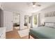 Bedroom offers closet with mirrored doors, wood floors, and outdoor views at 4950 N Miller Rd # 200, Scottsdale, AZ 85251