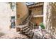 Exterior view of apartment building with stairs leading to upper units at 4950 N Miller Rd # 200, Scottsdale, AZ 85251
