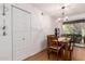 Dining room has wood table and chairs plus access to the patio at 4950 N Miller Rd # 200, Scottsdale, AZ 85251