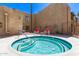 Community hot tub provides relaxation and features tiled interior and lounging chairs nearby at 4950 N Miller Rd # 200, Scottsdale, AZ 85251