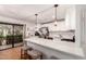 Well-lit kitchen with a breakfast bar, stainless steel appliances, and a view to the outdoor patio at 4950 N Miller Rd # 200, Scottsdale, AZ 85251